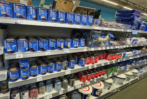 Shelf with paints and building materials in a store – example of high-quality products used during renovation